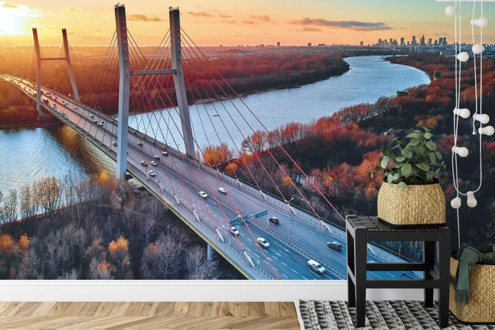 Fototapeta Beautiful Panoramic Aerial Drone View To Cable-Stayed Siekierkowski Bridge Over The Vistula River And Warsaw City Skyscrapers, Poland In Gold Red Autumn Colors In November Evening At Sunset