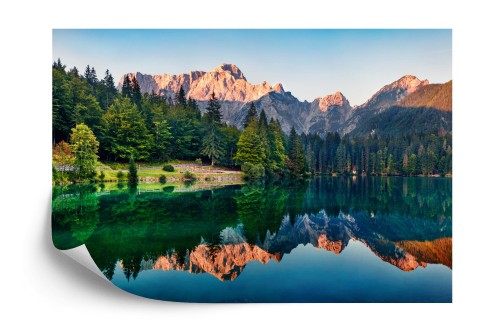 Fototapeta Calm Morning View Of Fusine Lake. Colorful Summer Sunrise In Julian Alps With Mangart Peak On Background, Province Of Udine, Italy, Europe. Beauty Of Nature Concept Background.