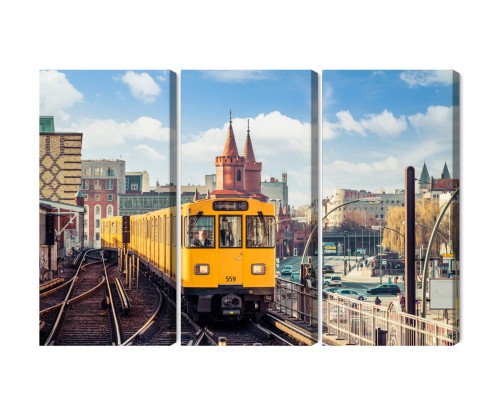 Obraz Wieloczęściowy Żółty Pociąg W Berlinie Na Torach Kolejowych